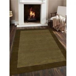 Jensendistributionservices 5 x 8 ft. Hand Tufted Wool Solid Rectangle Area Rug; Green
